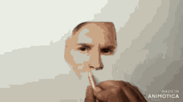 a drawing of a man 's face is being made by made in animatica