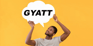 a man is holding a speech bubble with the word gyatt written in it .