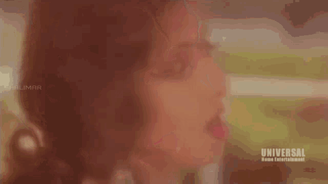 a close up of a woman 's face with the word universal on the bottom right .