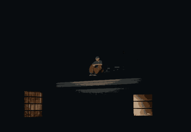 a man is sitting on the roof of a blue building
