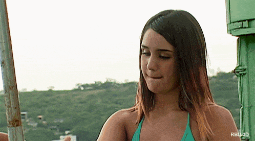 a woman in a green bikini with the letters rbd3d on the bottom