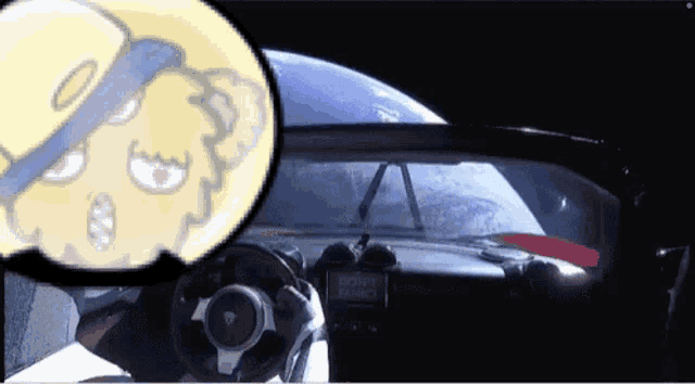 a car with a sticker on the dashboard that says " do n't panic "