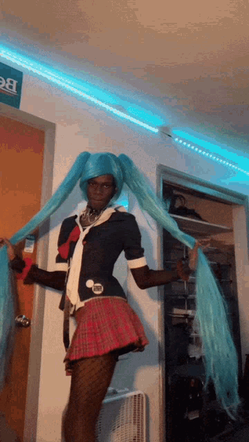 a person in a blue wig is standing in front of a door
