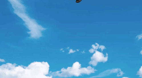 a puppet is flying through the air on a parachute