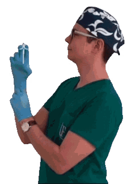 a man in a green scrub top with the letter e on the front