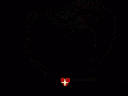 a red heart with sparkles coming out of it on a black background