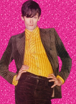 a man with his hands on his hips is wearing a yellow striped shirt and a green suit