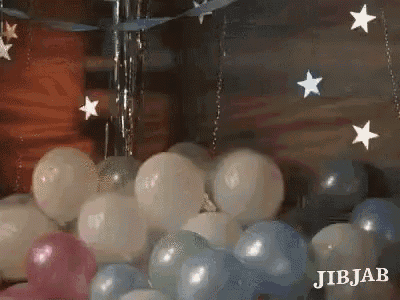 a bunch of balloons with stars hanging from the ceiling and the word jibjab on the bottom