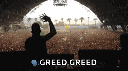 a man stands in front of a crowd and greed greed is written on the bottom