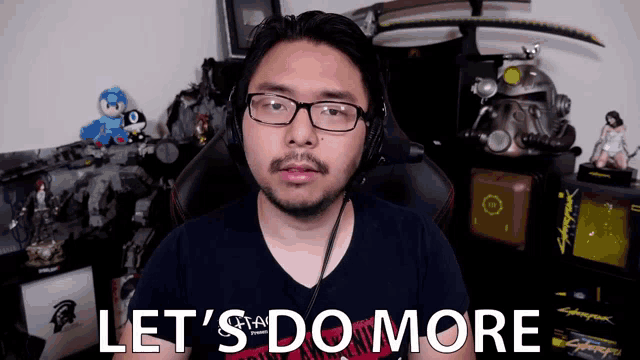 a man wearing glasses and headphones says " let 's do more "