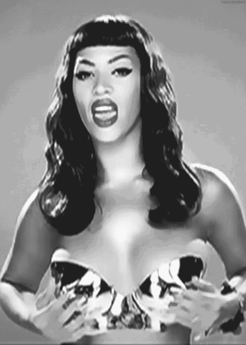 a black and white photo of a woman without a shirt on