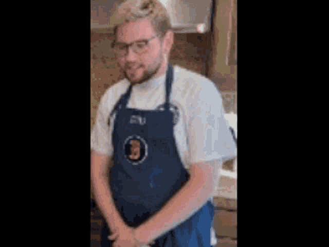 a man wearing an apron with a picture of a man on it