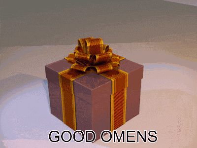 a gift box with the words good omens written on it