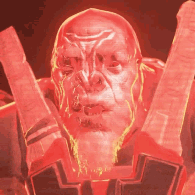 a close up of a man 's face with a red background