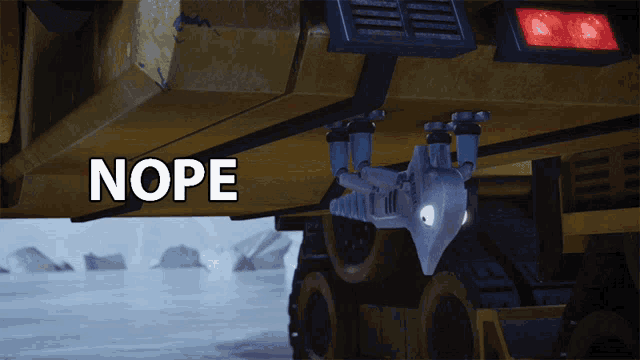 a robot is sitting under a vehicle and the word nope is on the bottom