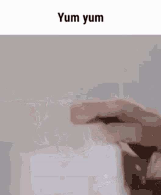 a close up of a person 's hand using a computer mouse with the words yum yum written on the bottom .