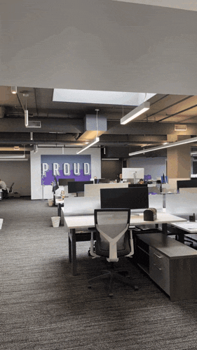 an office with a sign that says proud