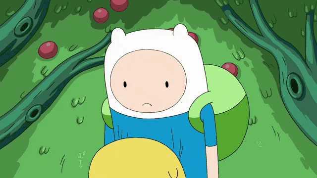 a cartoon character with a sad look on his face is laying in the grass