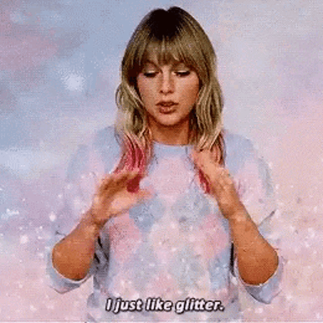 a woman with pink hair says i just like glitter