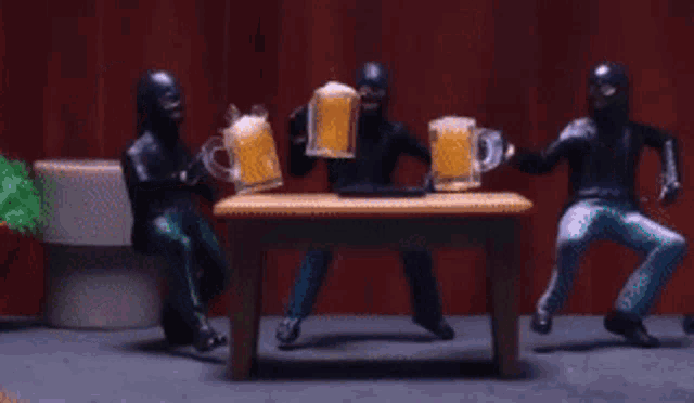 a group of men holding beer mugs are standing around a table