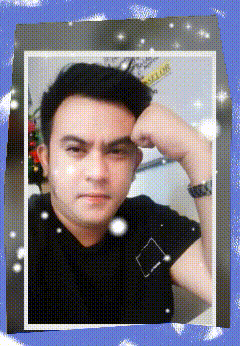 a picture of a man in a black shirt with a square on his shirt
