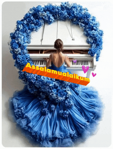 a woman in a blue dress is playing the piano
