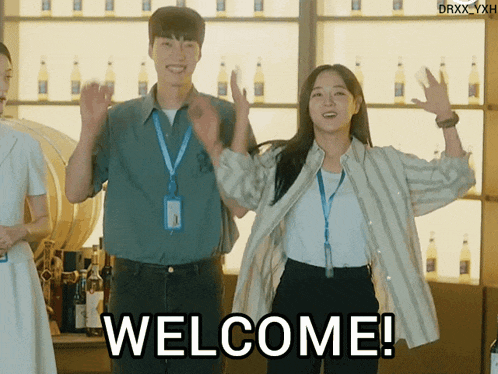 a man and a woman standing next to each other with the words welcome written on the bottom