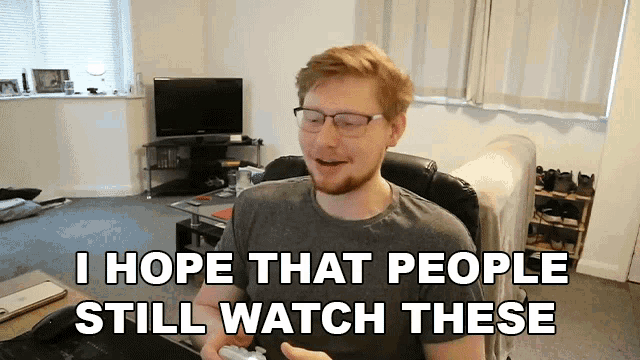a man sitting in a chair with the words " i hope that people still watch these " behind him