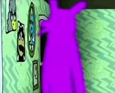 a purple cartoon character is standing in front of a green wall with cartoon faces on it .