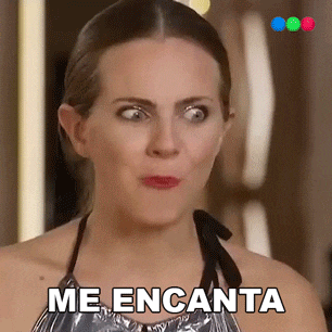 a woman is making a funny face and the words me encanta are visible