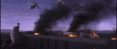 a group of fighter jets flying over a burning vehicle