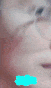 a close up of a person 's face with a blue circle around it