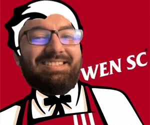 a man with glasses and a beard is wearing a kfc uniform