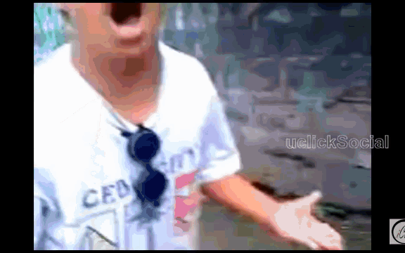 a man wearing a white shirt that says ceb