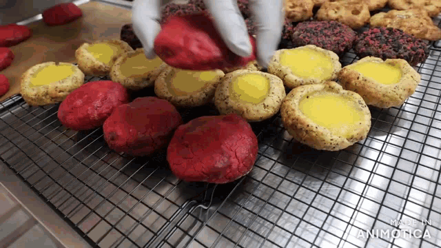 a bunch of cookies on a cooling rack with the words made in animatica
