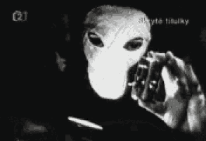 a black and white photo of a person holding a light bulb with the word zawadj written in white