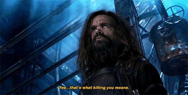 a man with long hair and a beard is saying yes that 's what killing you means