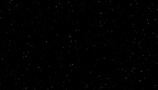 a black background with lots of white stars on it .