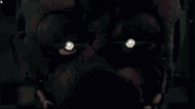 a close up of a monster 's eyes that are glowing