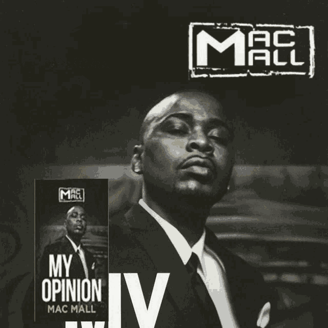 a man in a suit and tie is standing next to a book called my opinion by mac mall