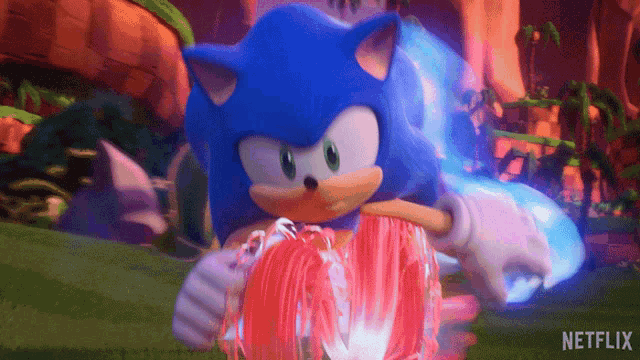 sonic the hedgehog from netflix is holding a red ball in his hands