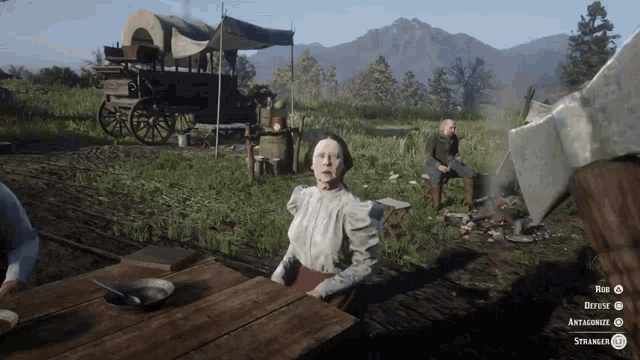 a woman sits at a table in a video game while a man sits on a bench in the background