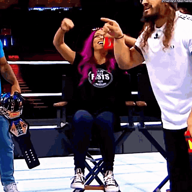 a woman with purple hair wearing a shirt that says fist