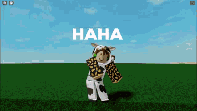 a cow is standing in a grassy field with the word haha written above her