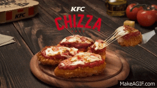 a kfc chizza pizza on a wooden plate