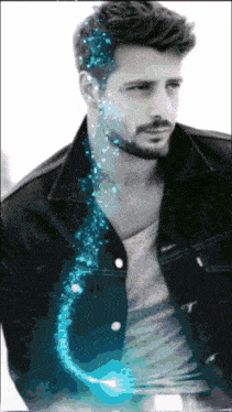 a black and white photo of a man with blue sparkles coming out of his face
