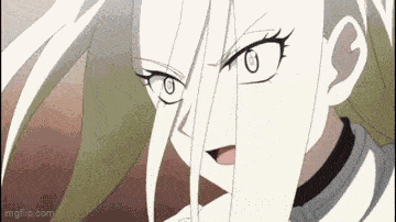 a close up of a person 's face with white hair and a very angry look on their face .