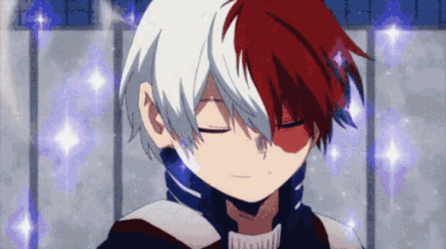 a close up of a boy with red and white hair