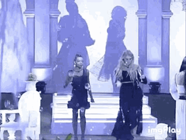 a group of women are walking down a runway .