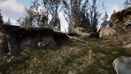 a car is sitting on top of a rock in the middle of a field .